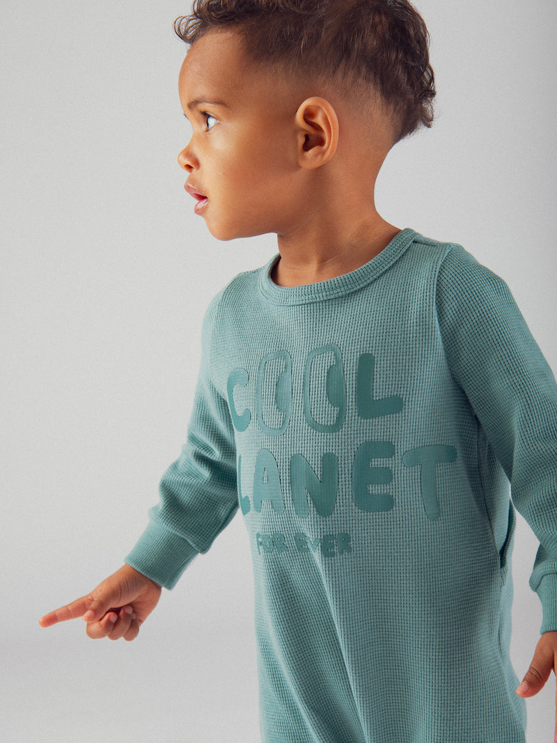 Grüne "Good Vibes" Baby-Schlafanzug aus gewirktem Material