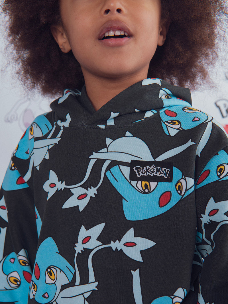 Graues Sweatshirt mit Pokémon Créhelf und Créfadet Druck