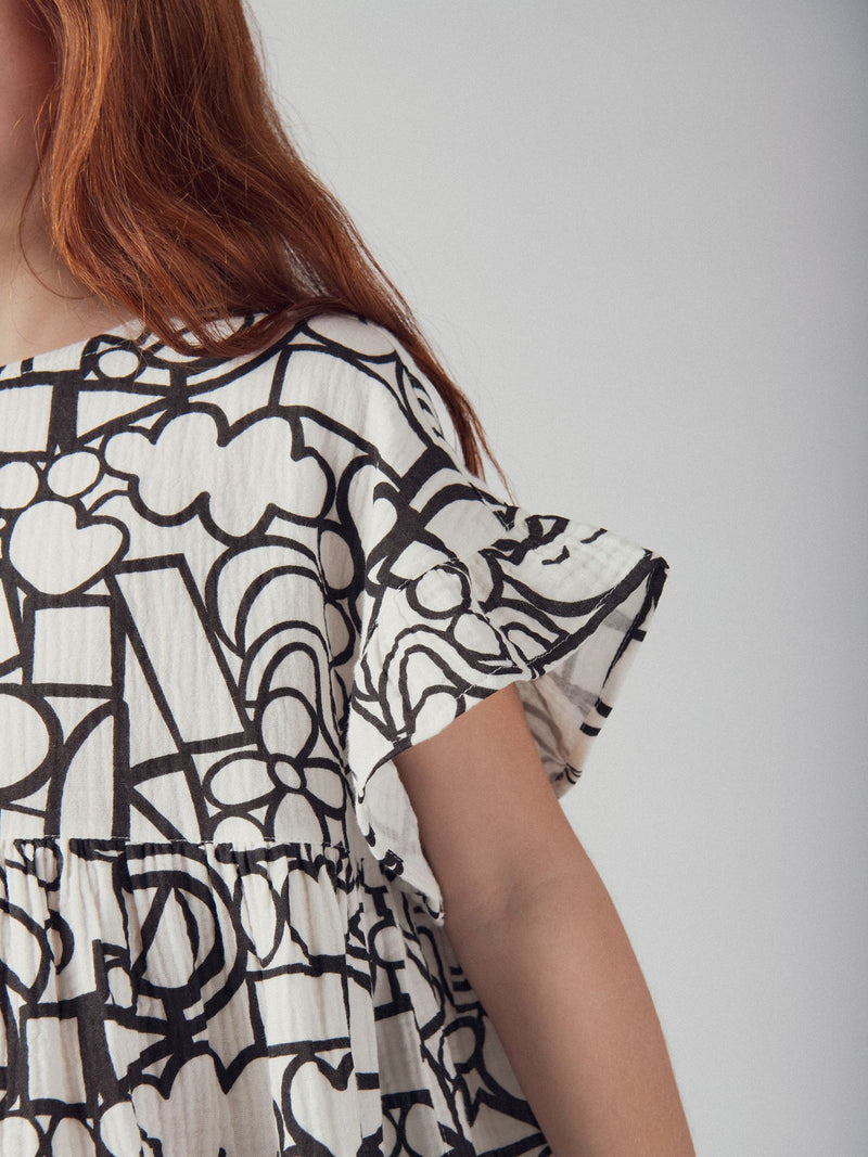 Grau-weißes Kleid mit grafischem Druck für Mädchen