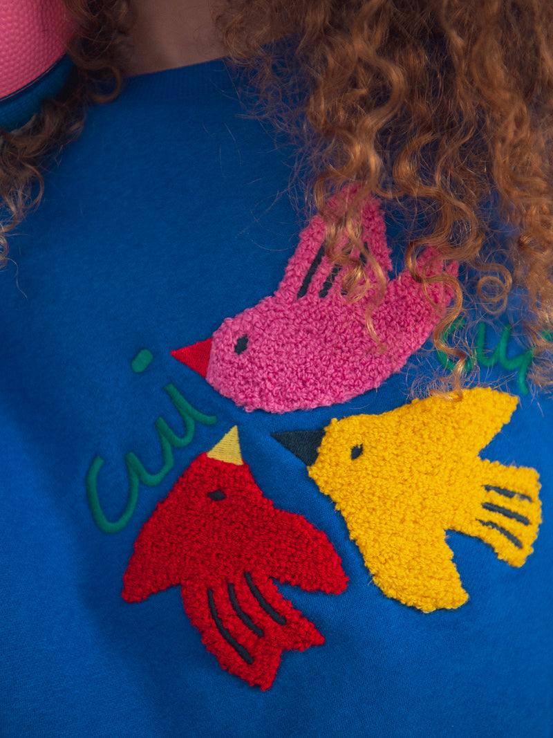 Blaues Sweatshirt mit Vogelanimation für Mädchen
