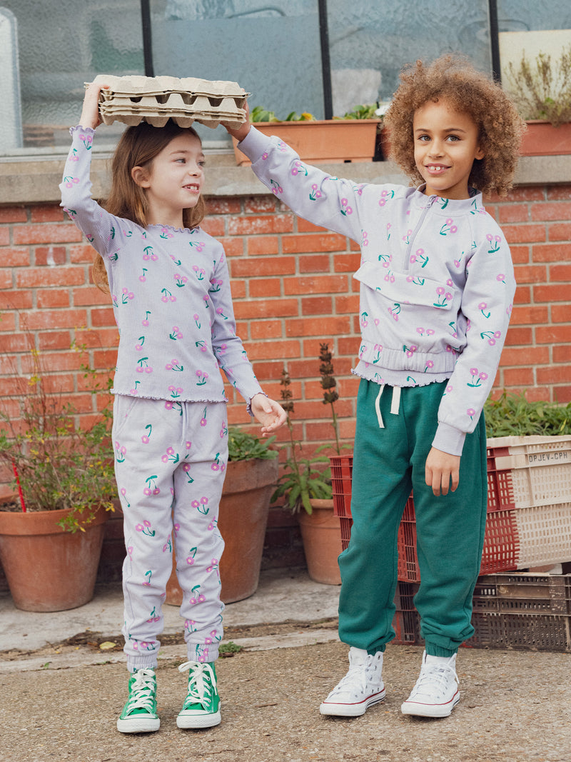 Lila Jogginghose mit Blumenmuster für Mädchen